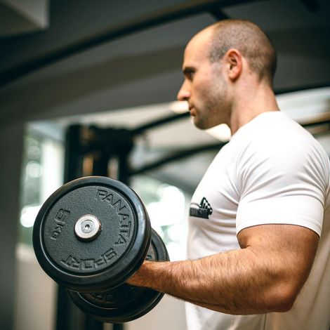 man lifting weights