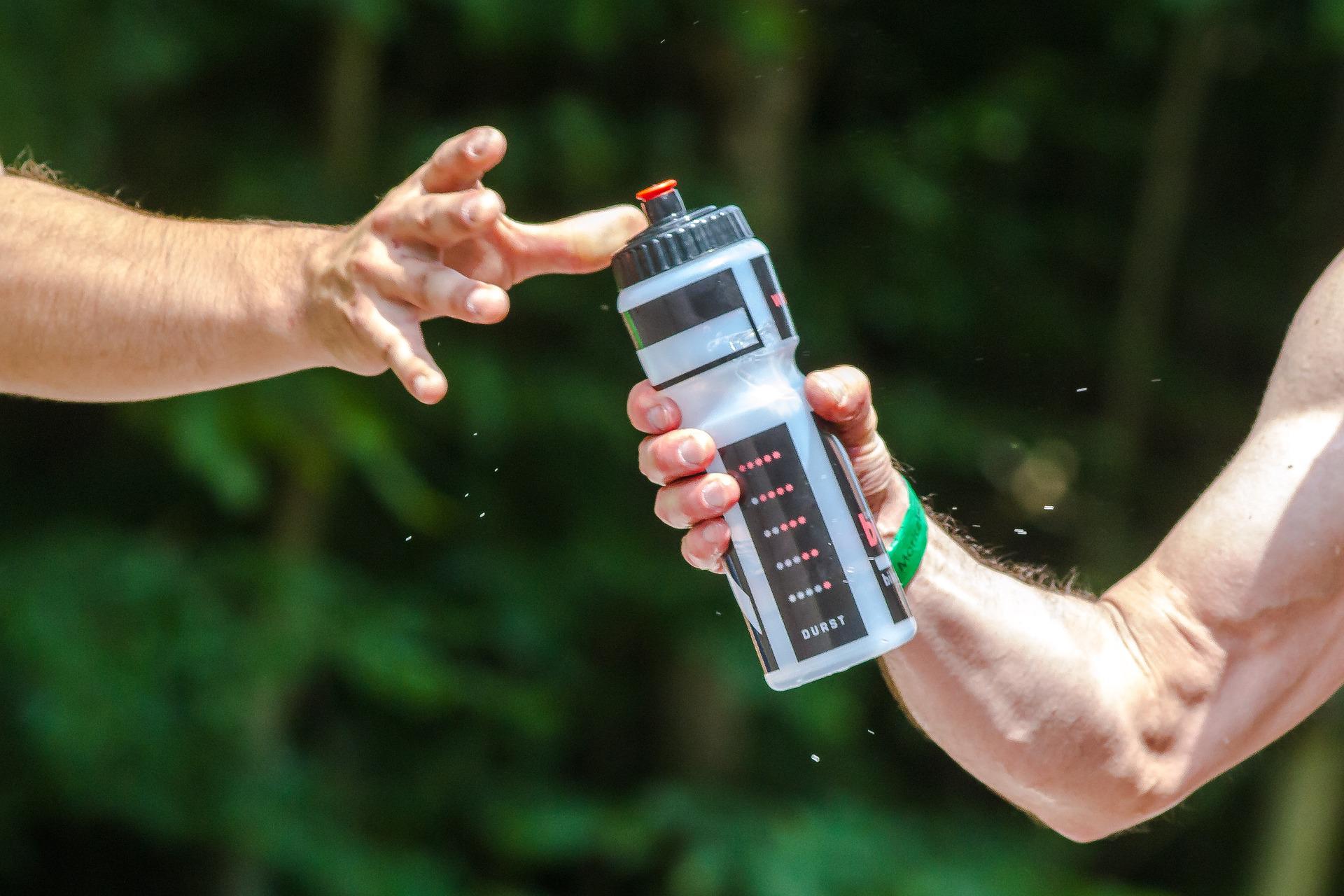 passing someone a water bottle