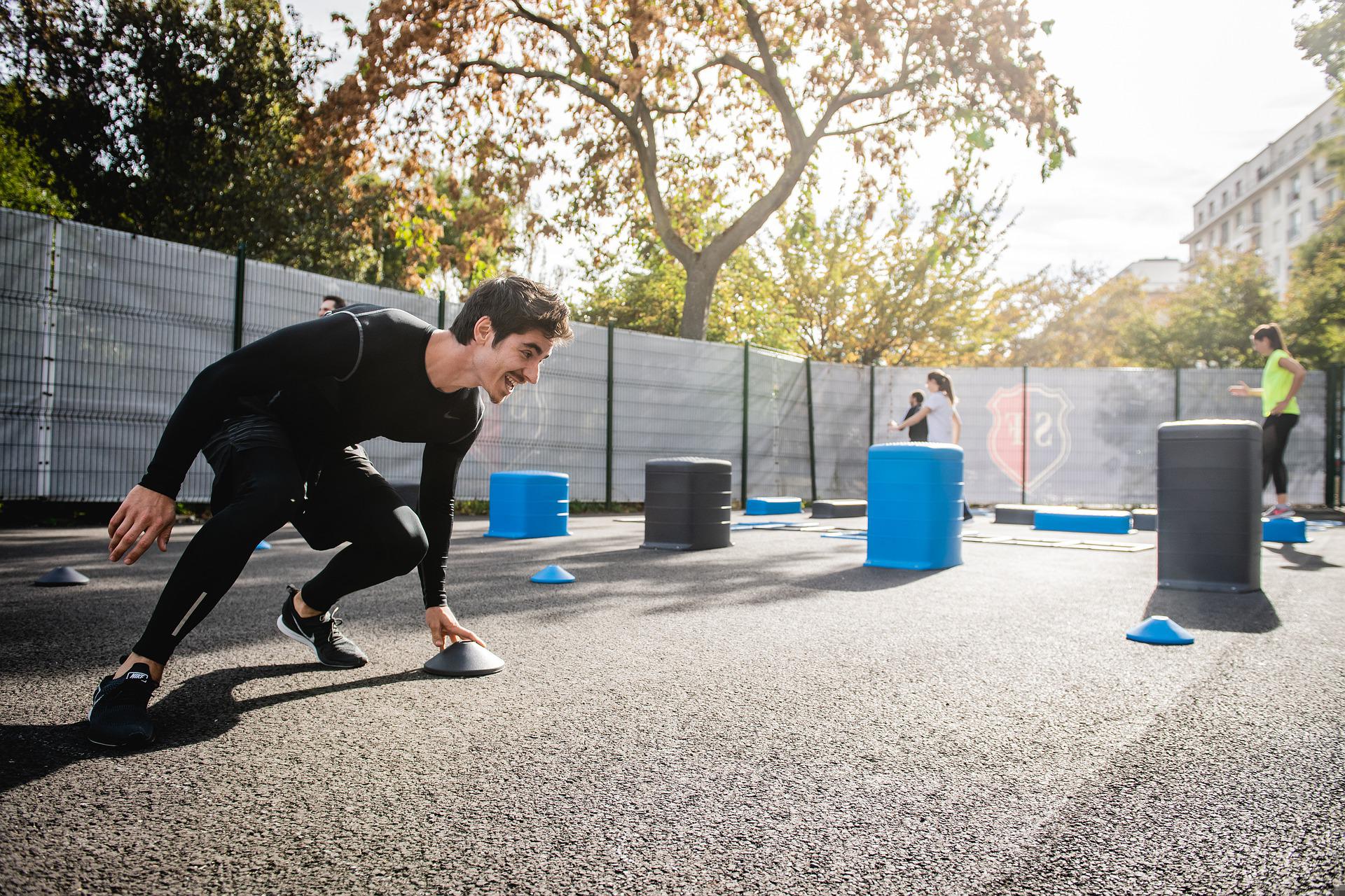 man using cross training course