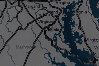 White and beige electric scooter parked on a pink background.