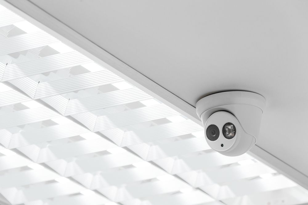 White Security Camera Mounted on a White Ceiling — NQ Video Surveillance in Mackay, QLD