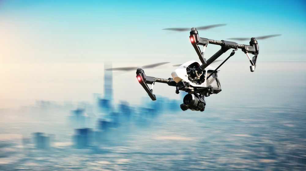 Drone in Flight Over a City Capturing Footage With a Camera — NQ Video Surveillance in Mareeba, QLD