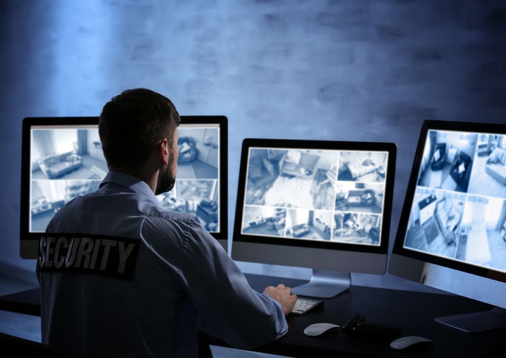 Security Guard Monitoring Surveillance Camera — NQ Video Surveillance in Townsville, QLD