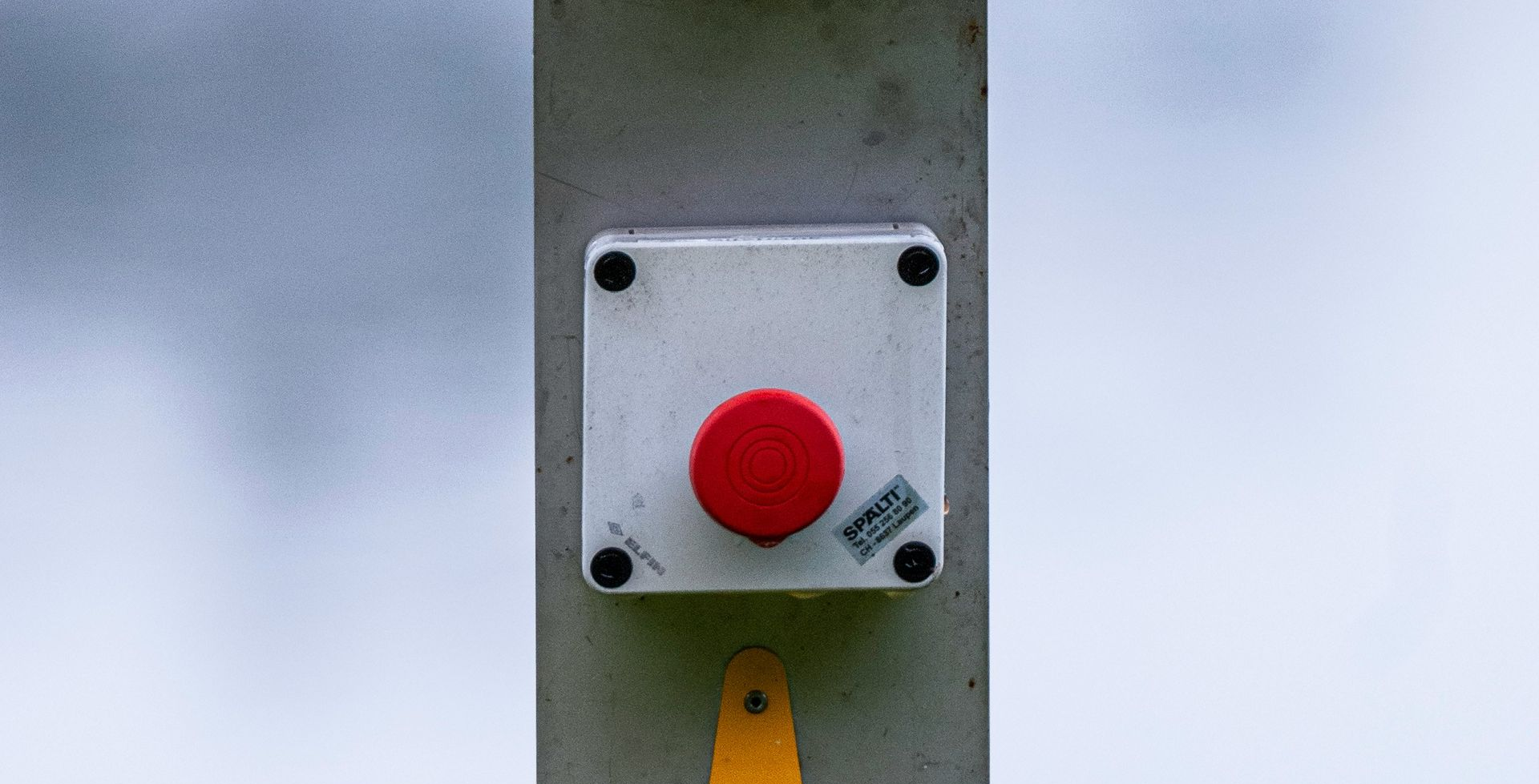 Red Emergency Button on a Gray Box — NQ Video Surveillance in Mt Isa, QLD