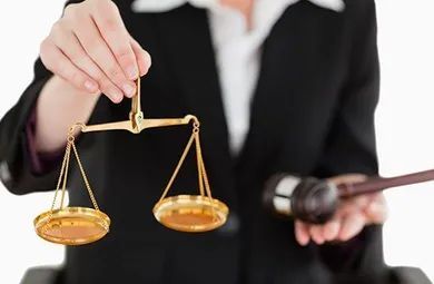 Woman Holding Scales of Justice and a Gavel — Hendersonville, TN — Frizzell & Frizzell, PLLC