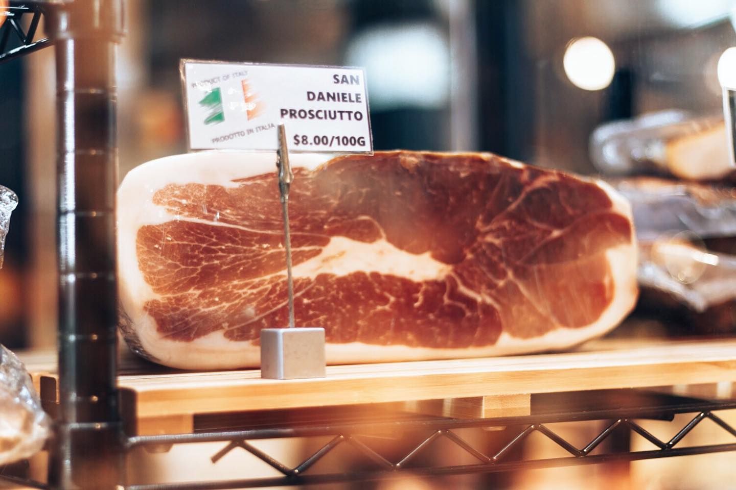 A Piece of Prosciutto is Sitting on a Shelf in a Store — Barbosa Fine Food Deli in Robina, QLD