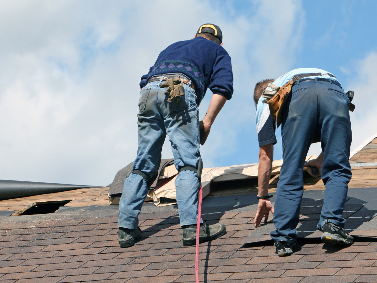 Two men working on replacing roof in lakewood, colorado.
