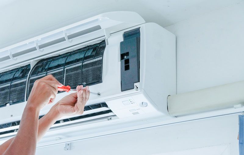 Installing New Air Conditioner — Castle Hill, NSW — Brennan Air Conditioning Pty Ltd Installing New Air Conditioner — Castle Hill, NSW — Brennan Air Conditioning Pty Ltd