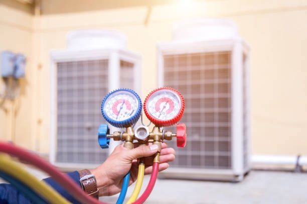 Checking HVAC Unit — Castle Hill, NSW — Brennan Air Conditioning Pty Ltd