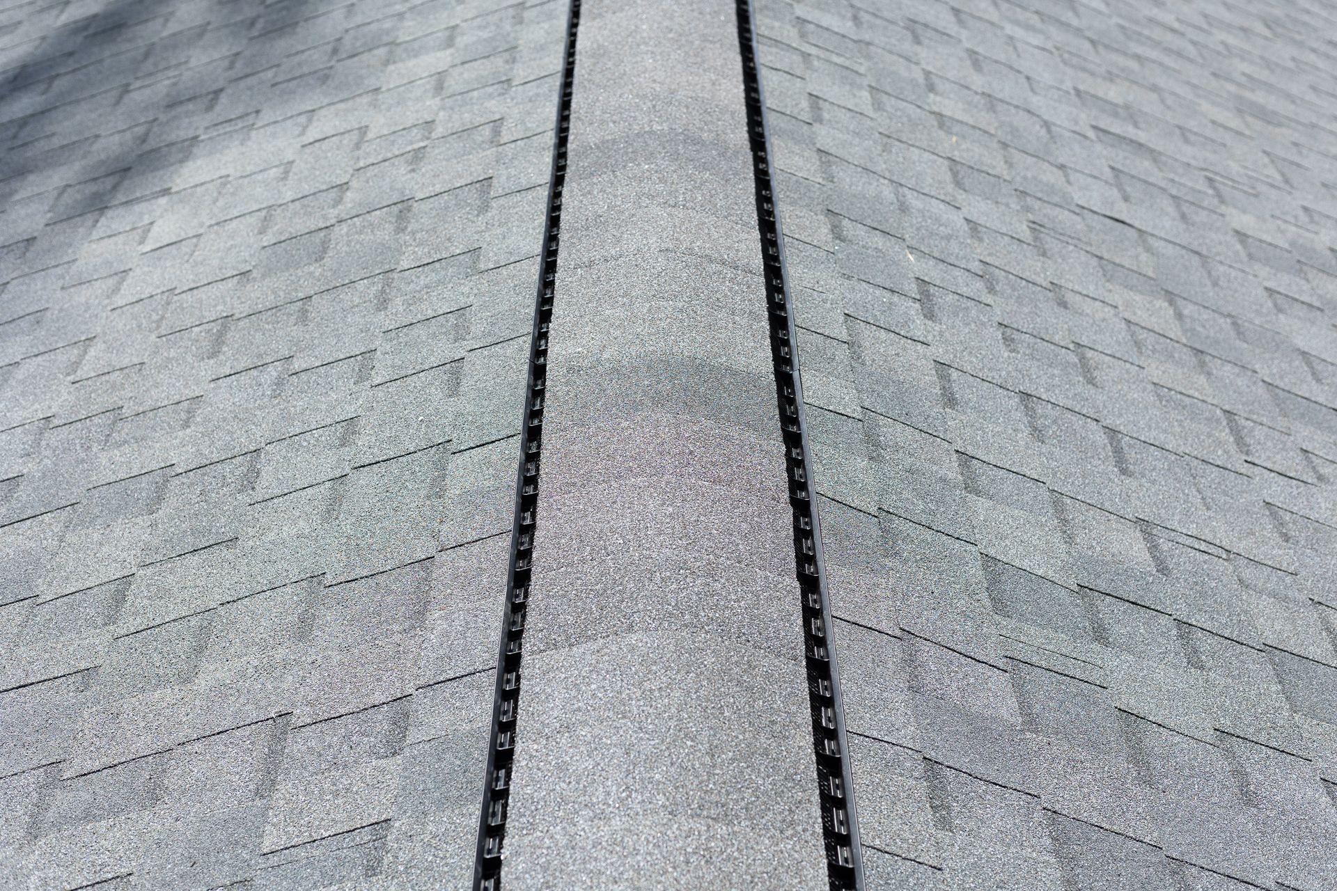Close-up image of RETEX roof replacement in North Chesterfield VA 23235. Ridge cap view.
