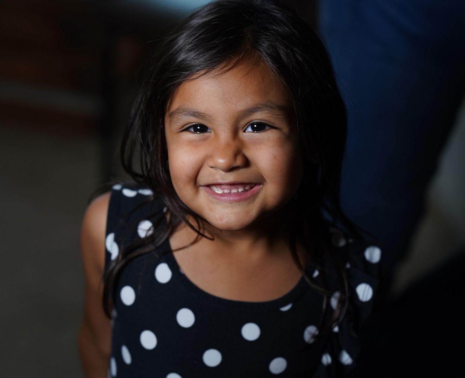 CASA  child smiling, representing trust and support in foster care advocacy.