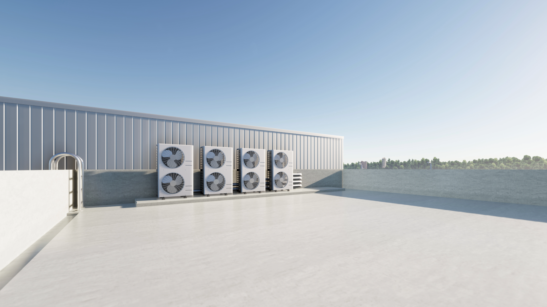 Rooftop with HVAC condenser units along a gray wall under a clear sky.