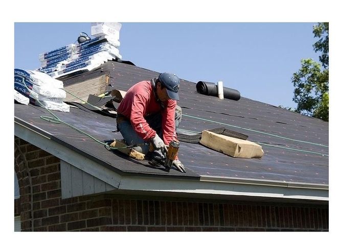 Man working on roof