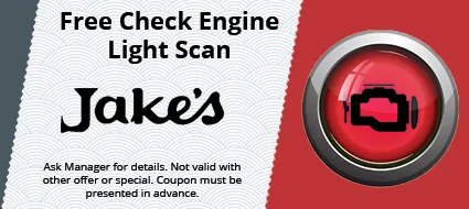 A sign that says free check engine light scan at jake 's