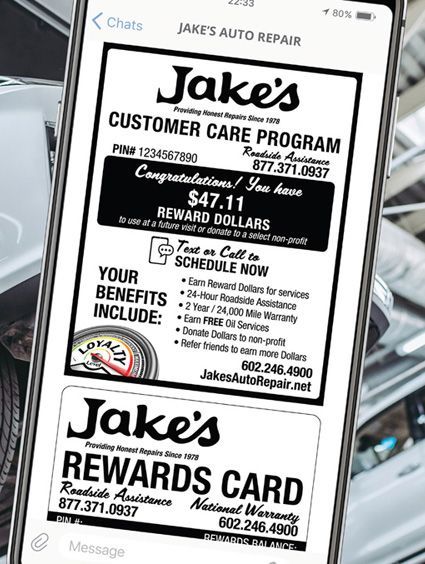 A phone screen shows an advertisement for jake 's auto repair