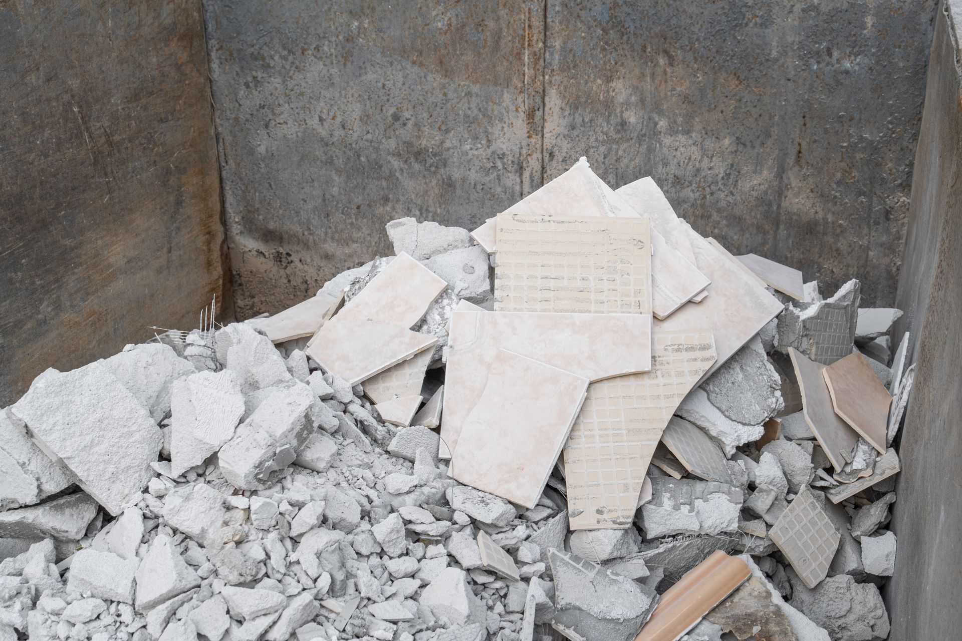 Discarded ceramic tiles and masonry rubble.