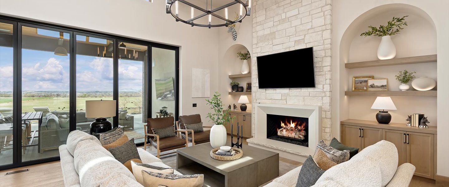 A living room with a fireplace and a flat screen tv.