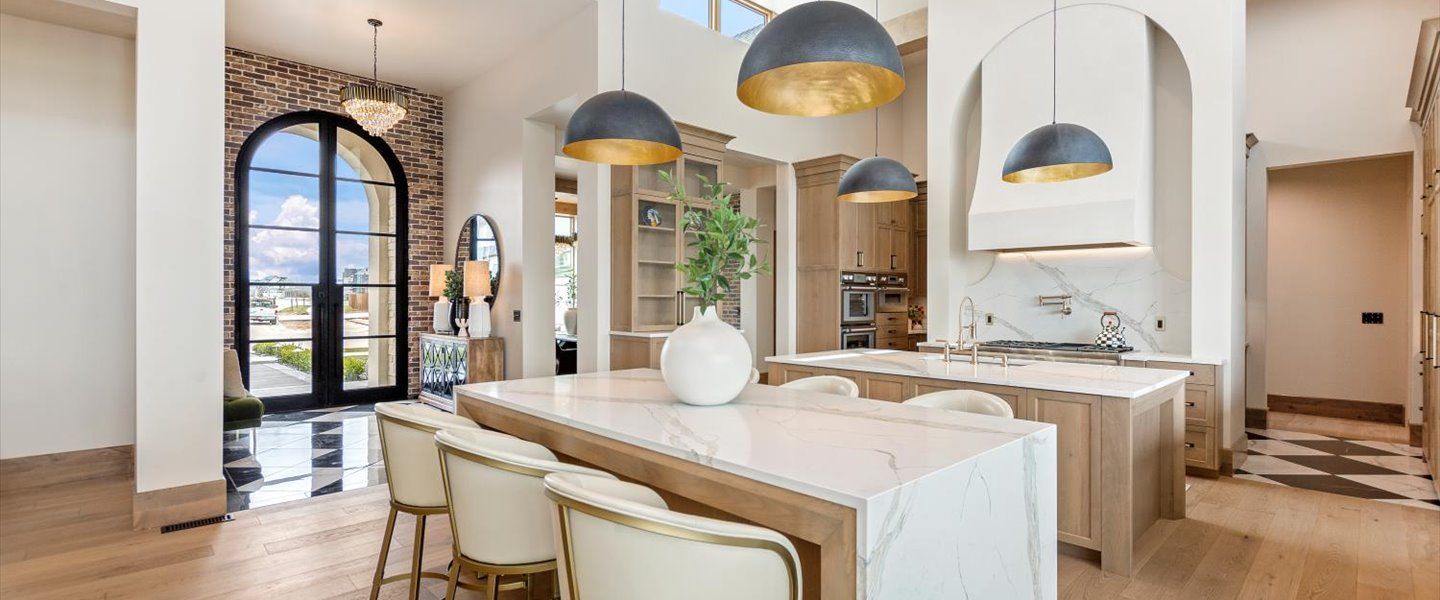 There is a large island in the middle of the kitchen.