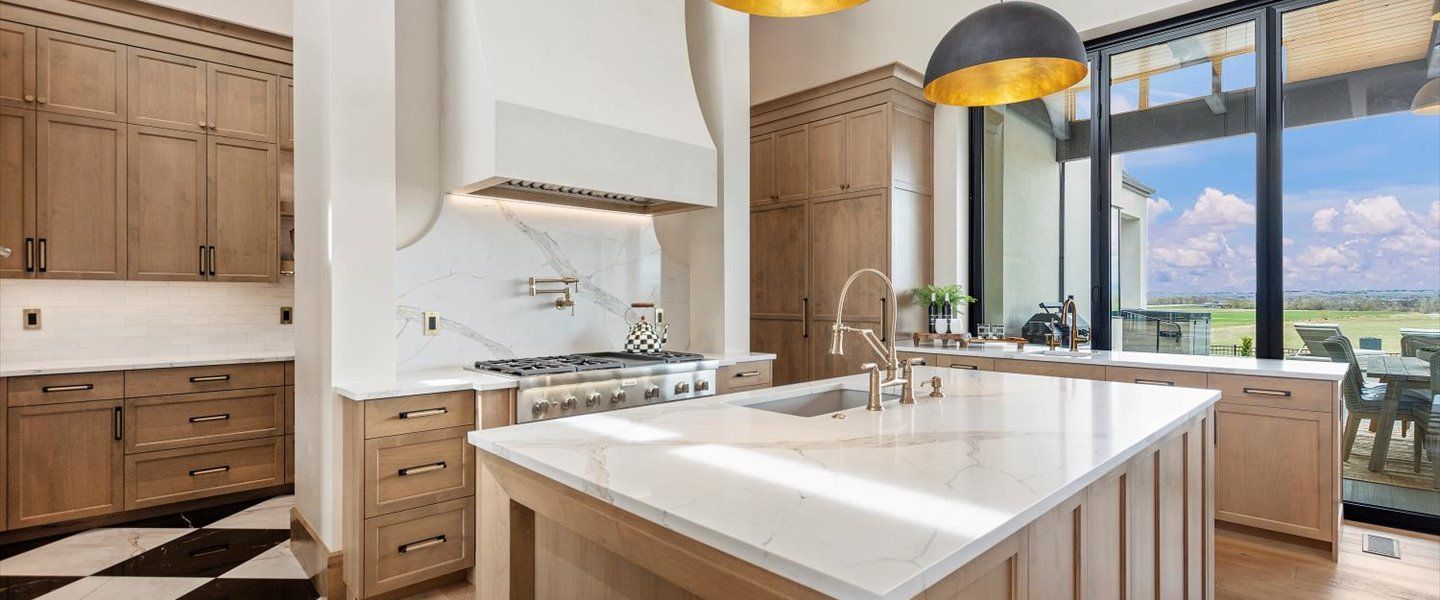 There is a large island in the middle of the kitchen.