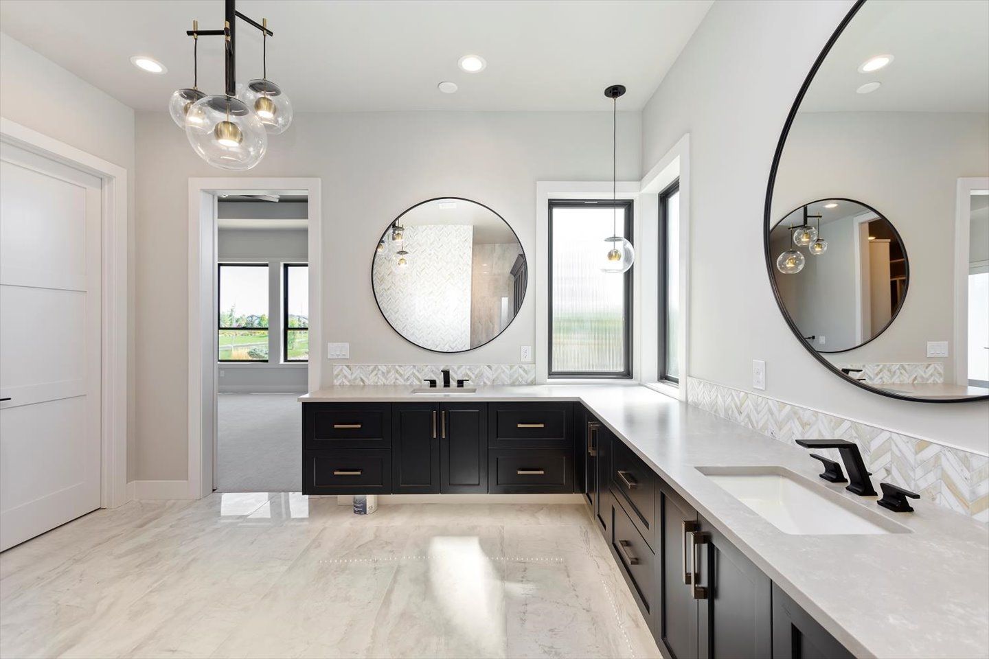 A bathroom with two sinks and two mirrors.
