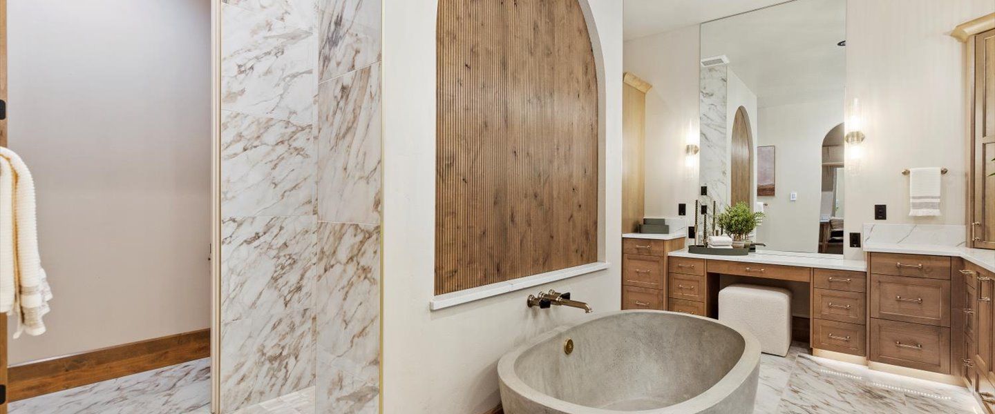 There is a bathtub in the middle of the bathroom.