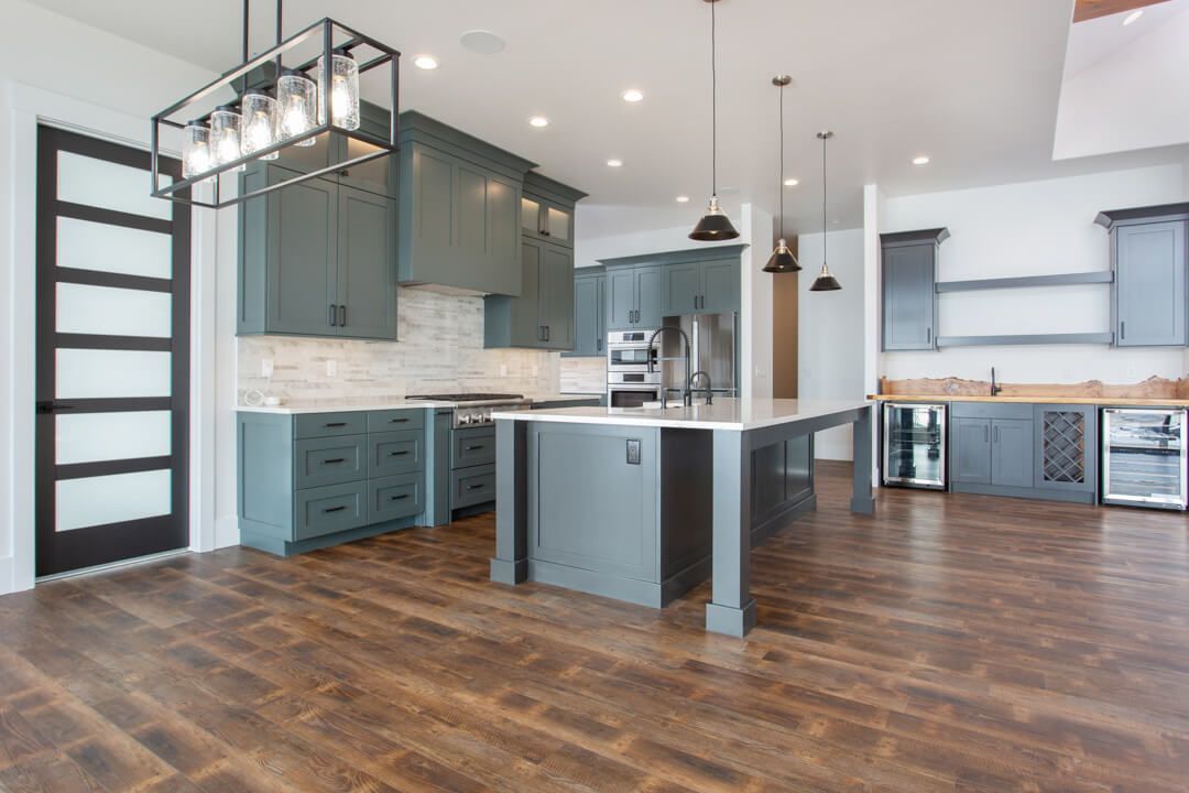 A kitchen with a large island in the middle of the room.