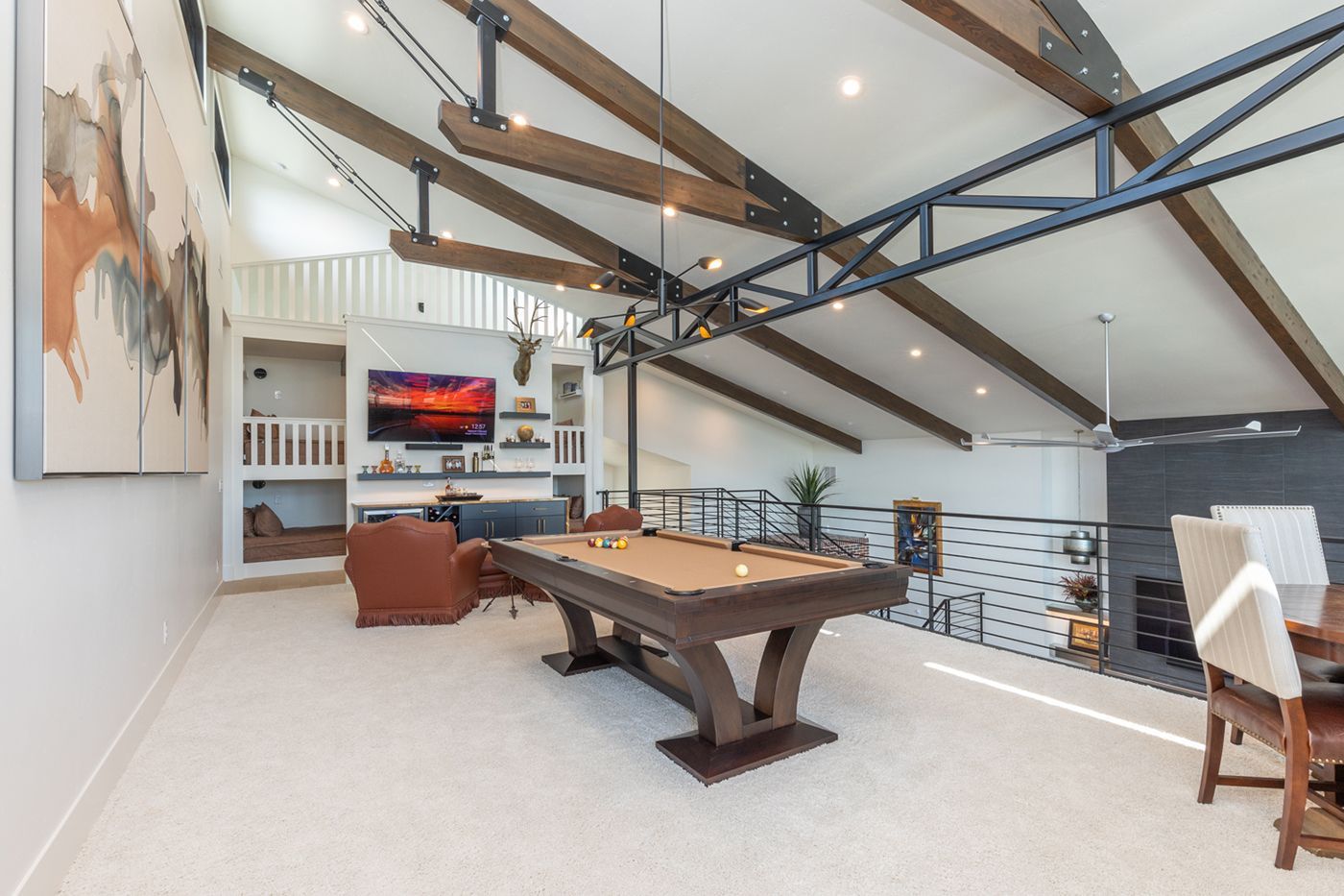 There is a pool table in the middle of the room.