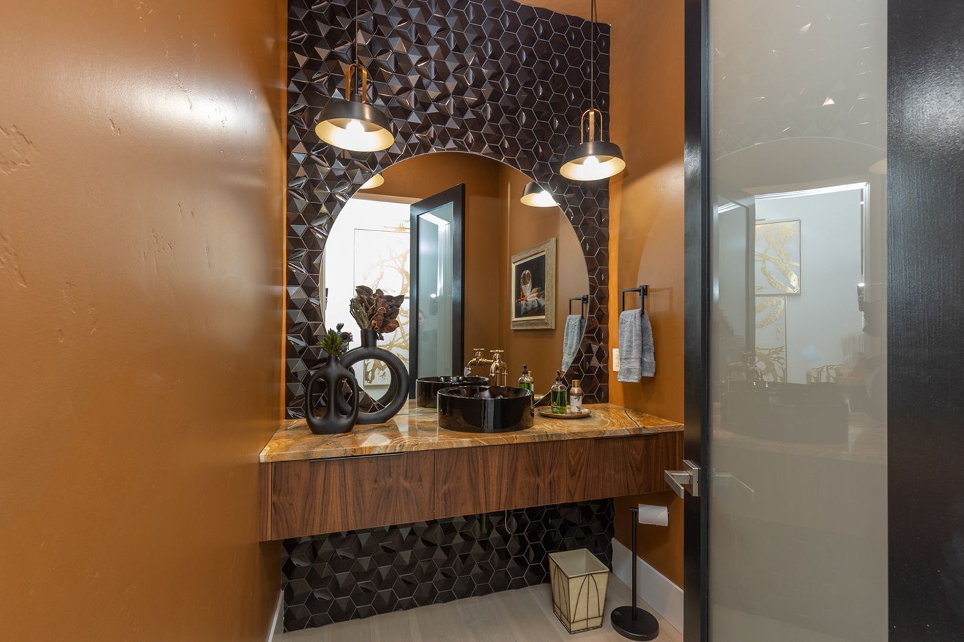 A bathroom with a sink and a mirror.