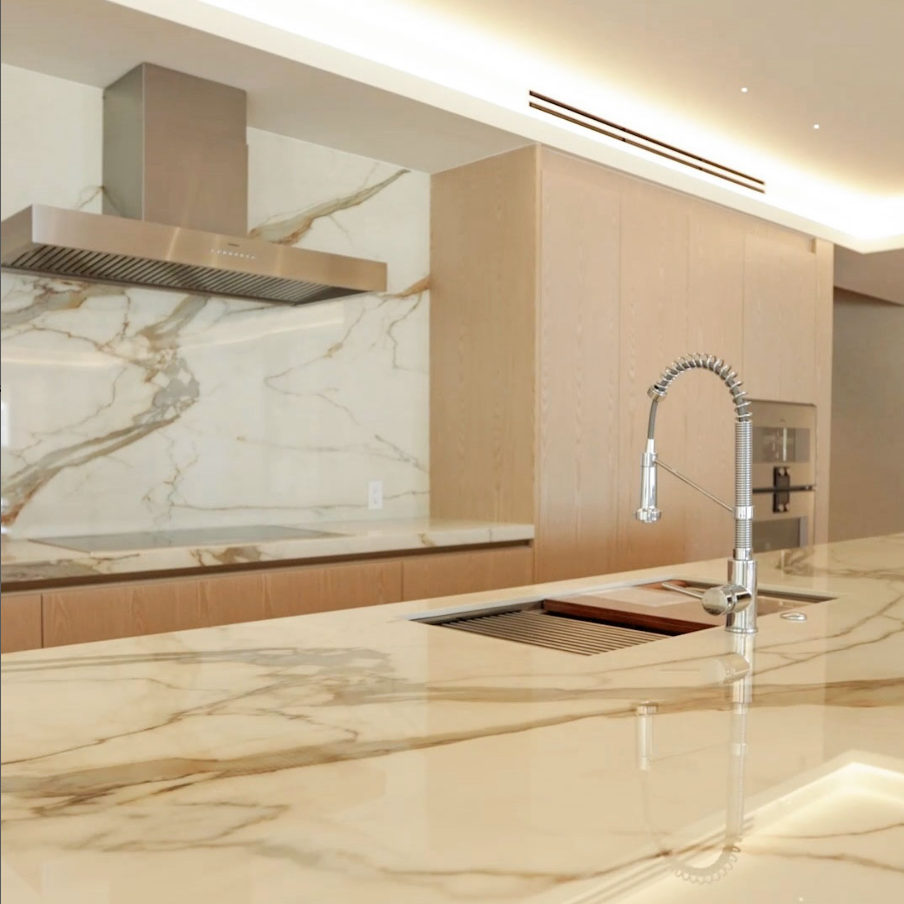 A kitchen with marble counter tops and a sink