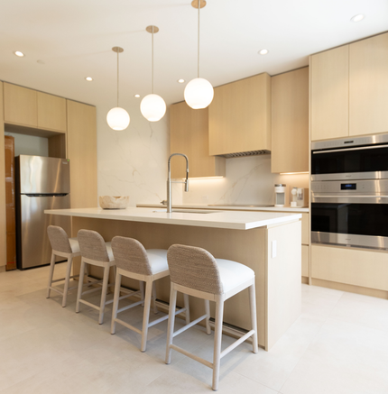 A kitchen with stainless steel appliances and a large island