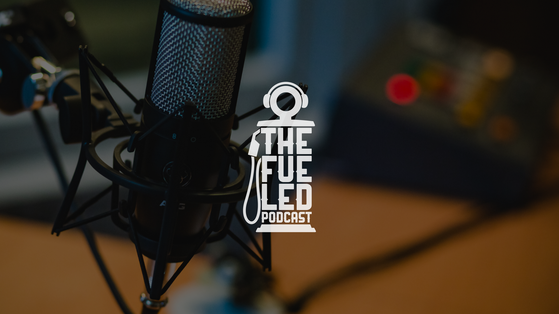 Podcast microphone with blurred audio gear and “The Life Feed Podcast” logo on screen