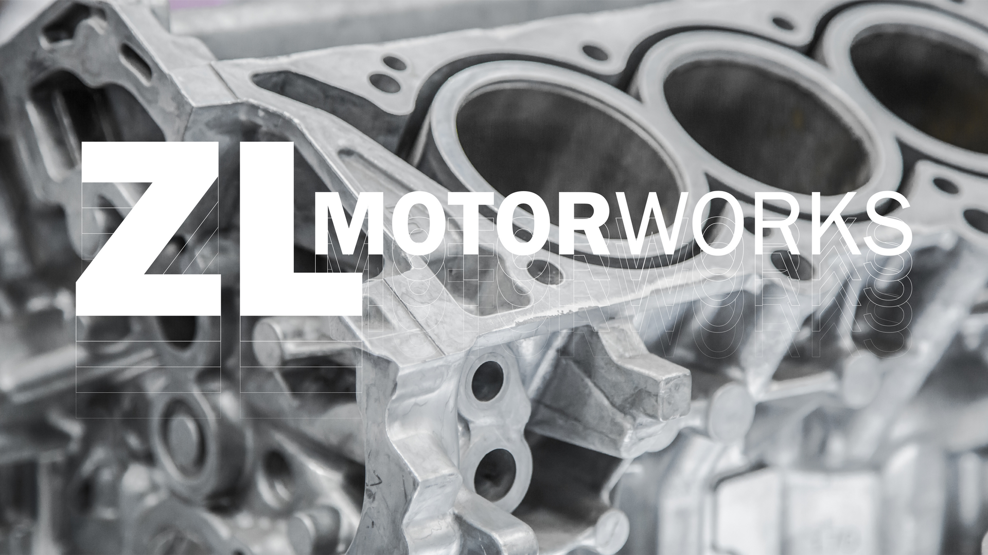 ZL Motorworks logo over a close-up of shiny metal mechanical parts