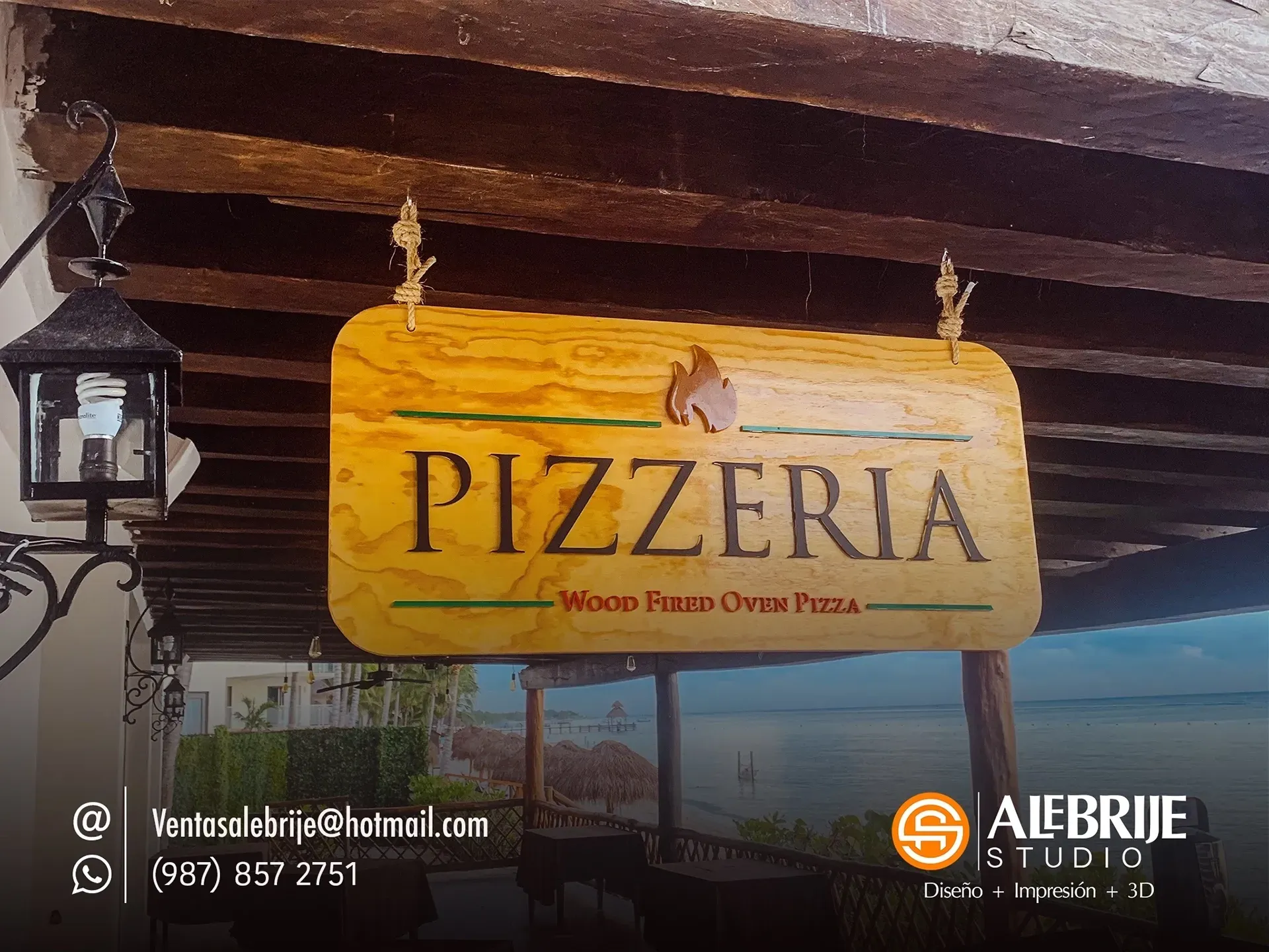 Un cartel de madera que dice pizzería.