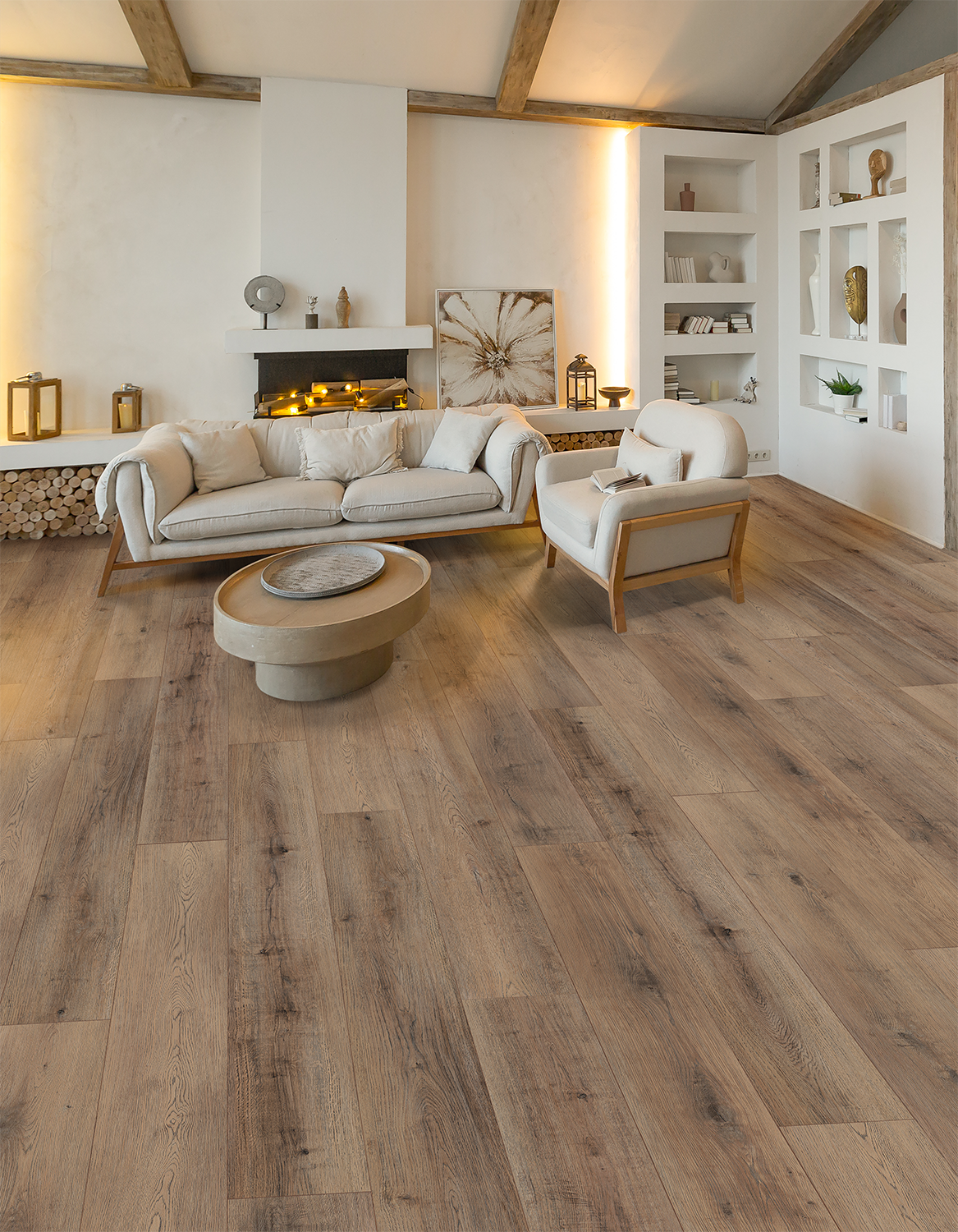 Bright living room with white sofas, a fireplace, and wood flooring in a modern rustic interior