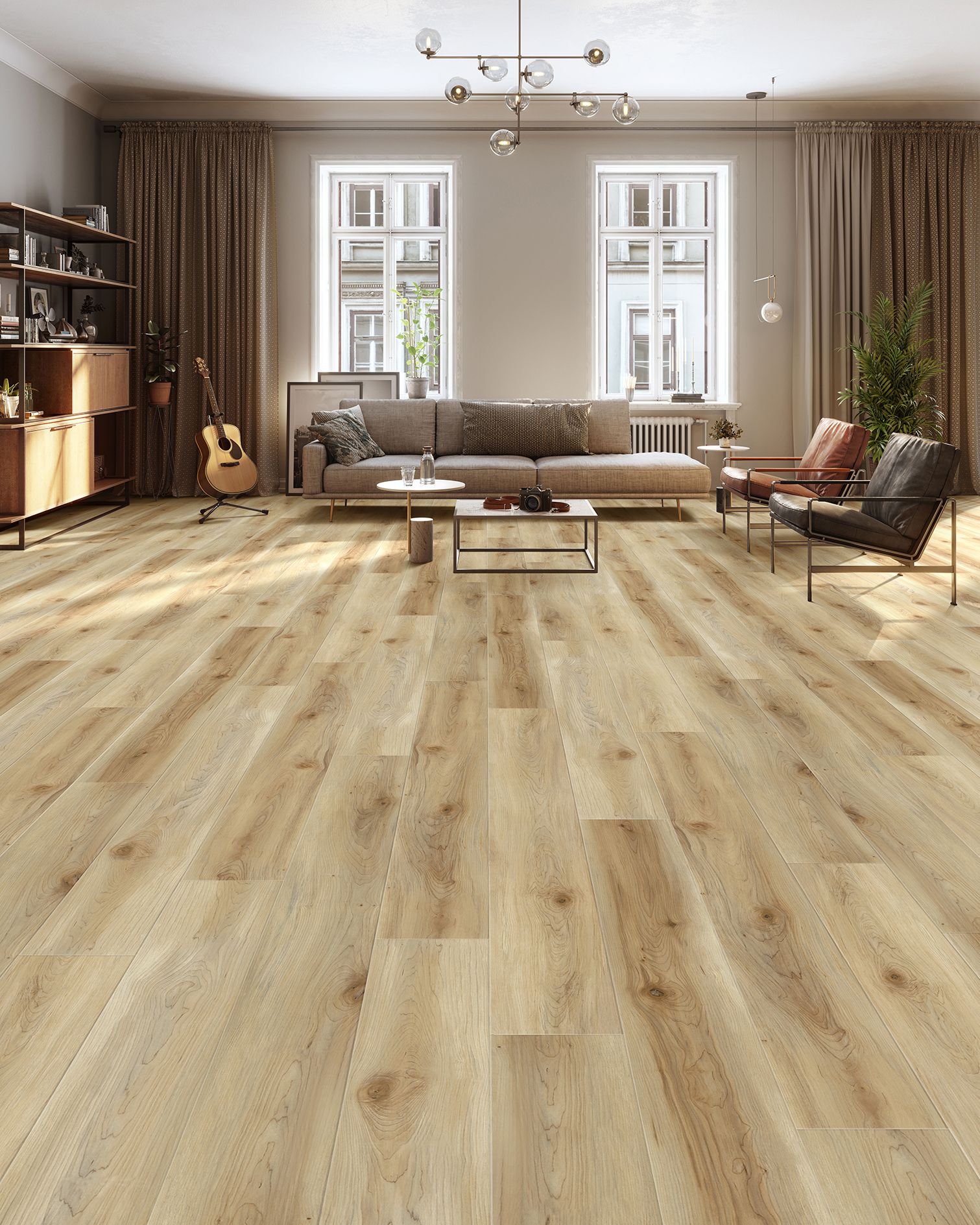 Bright living room with light wood floor, sofa, chairs, coffee table, and large windows