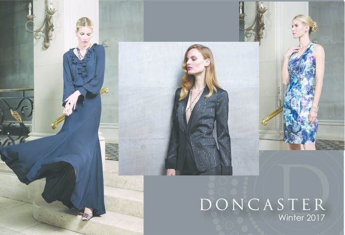 A woman in a blue dress is standing next to a woman in a blue suit and a woman in a blue dress.