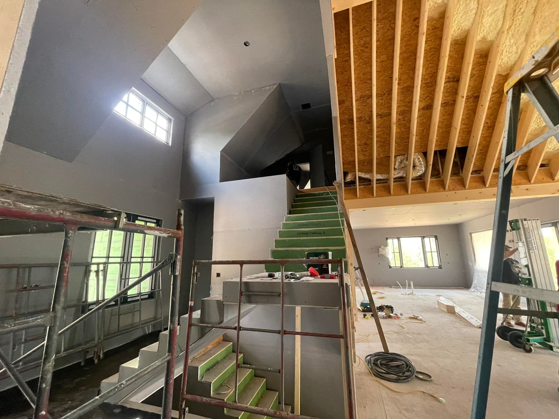 A staircase is being built in a house under construction.