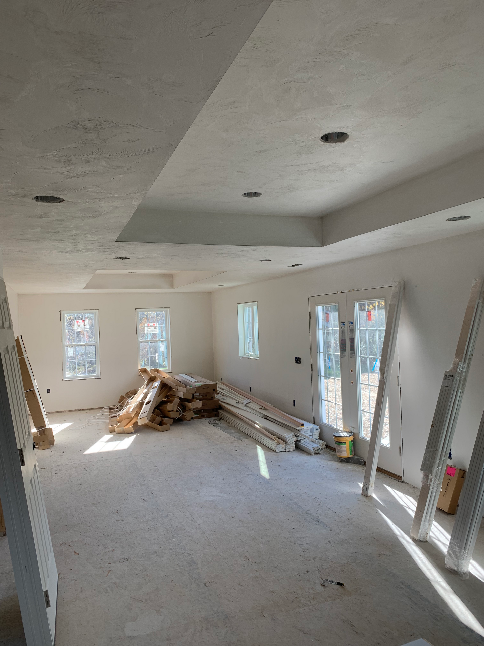 A large room with a lot of windows and a lot of wood in it.