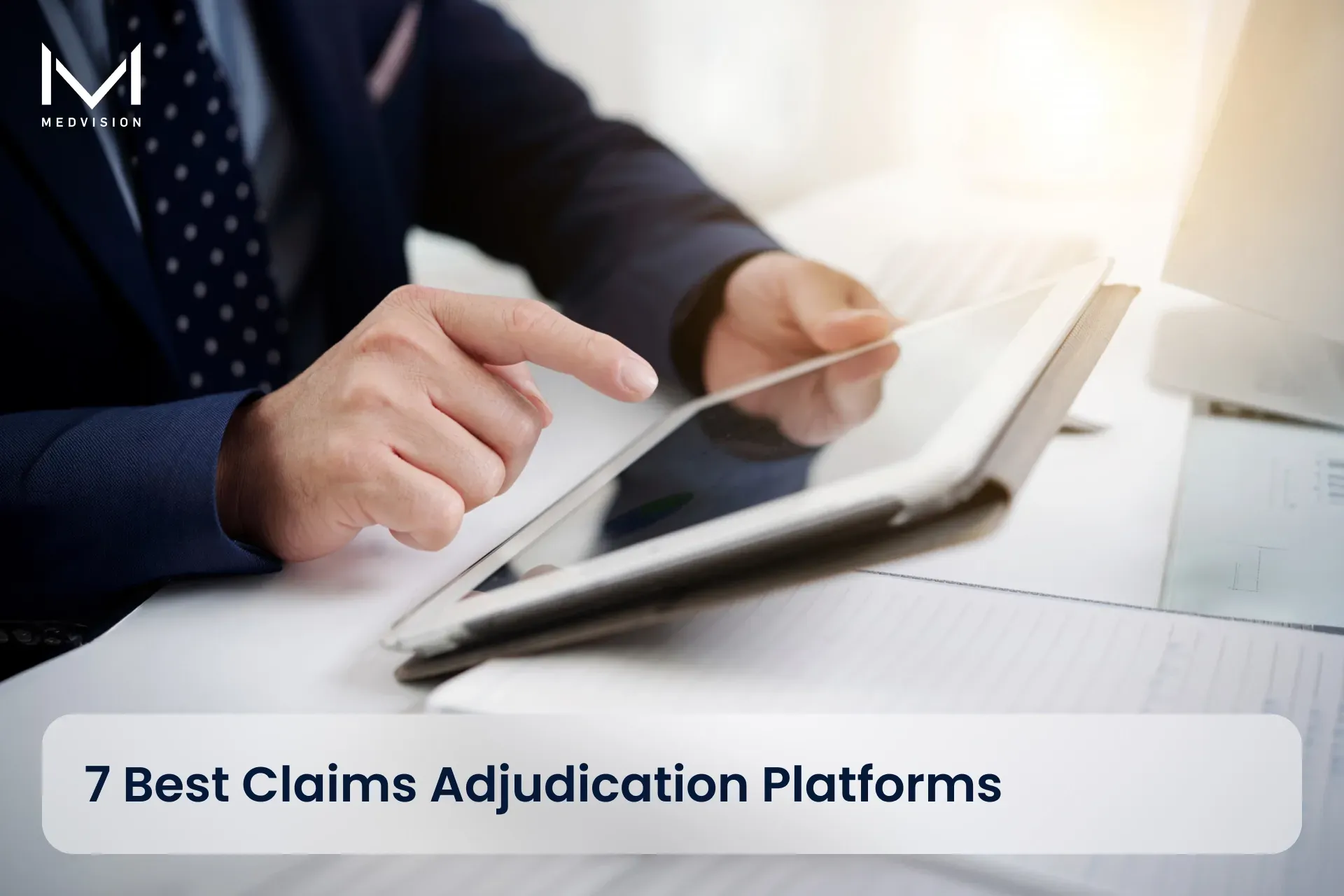 Payer operations team reviewing claims adjudication software dashboard in office