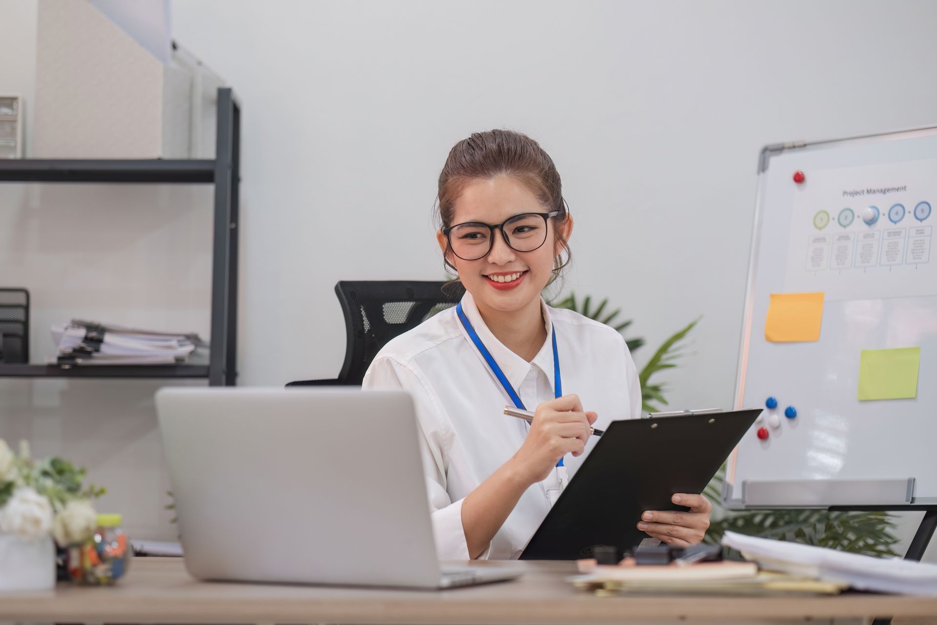 An administrator enjoying simpler and optimized healthcare management using advanced software.