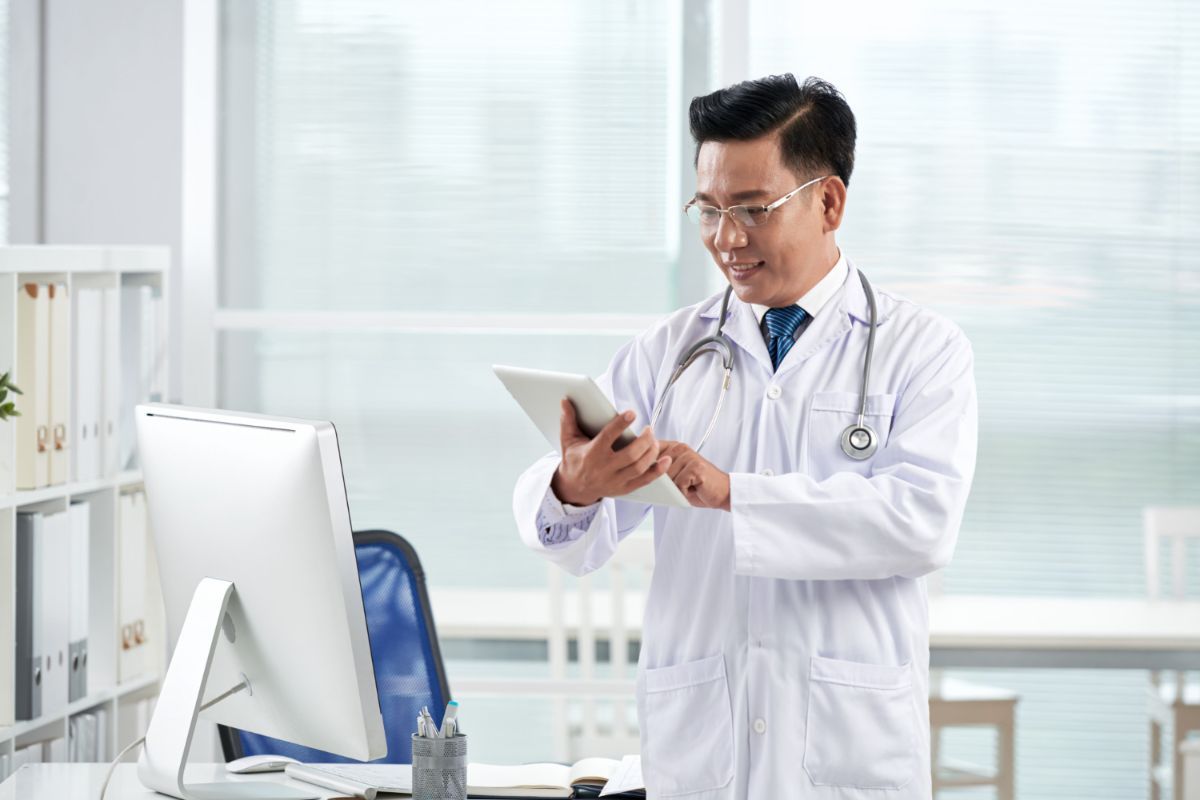 doctor using his electronic device