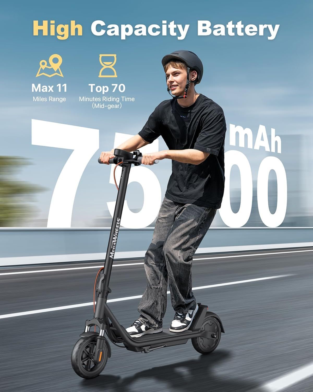 A man is riding a TD PRO electric scooter on a road.