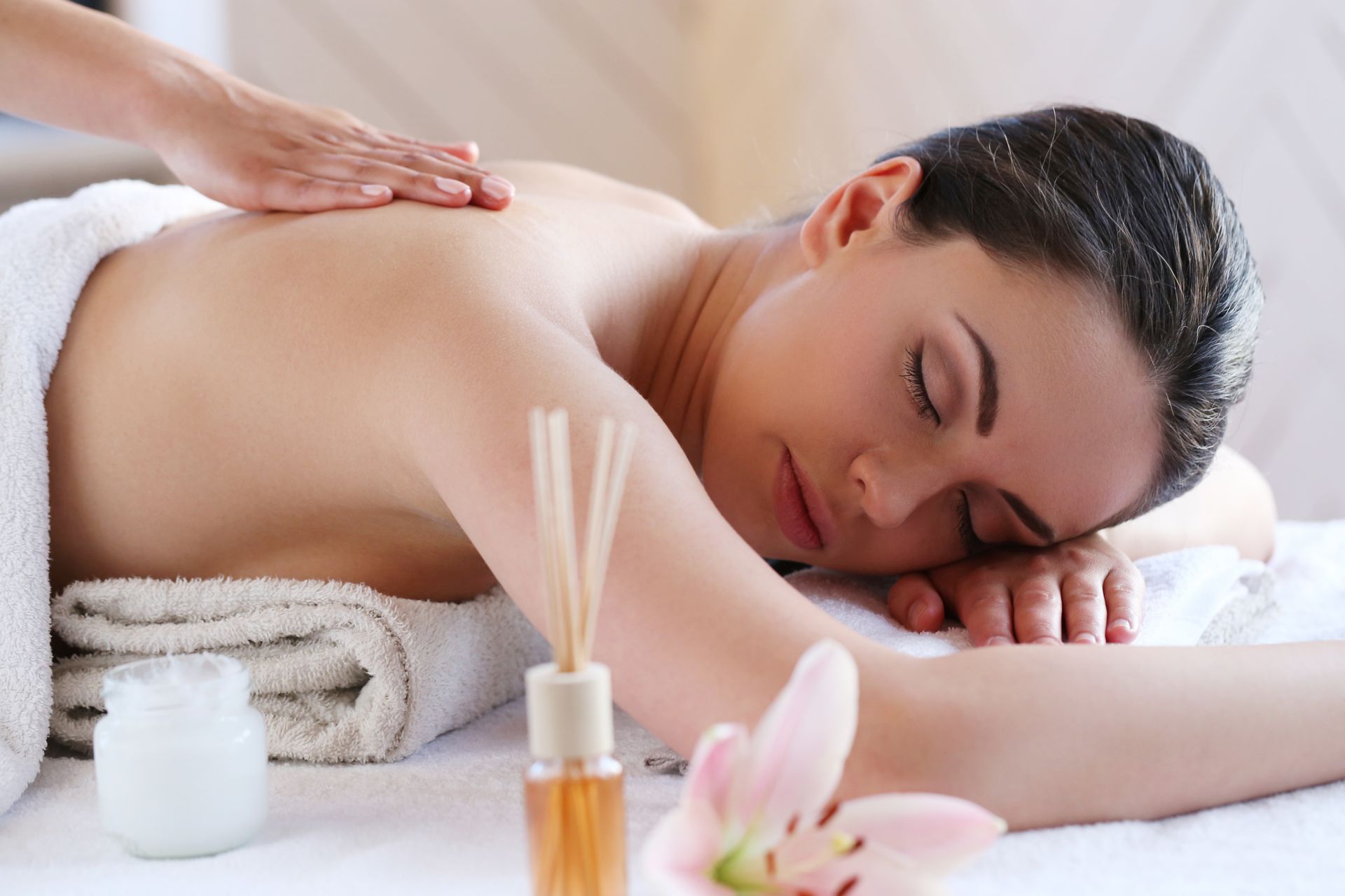 a woman is laying on a table getting a massage