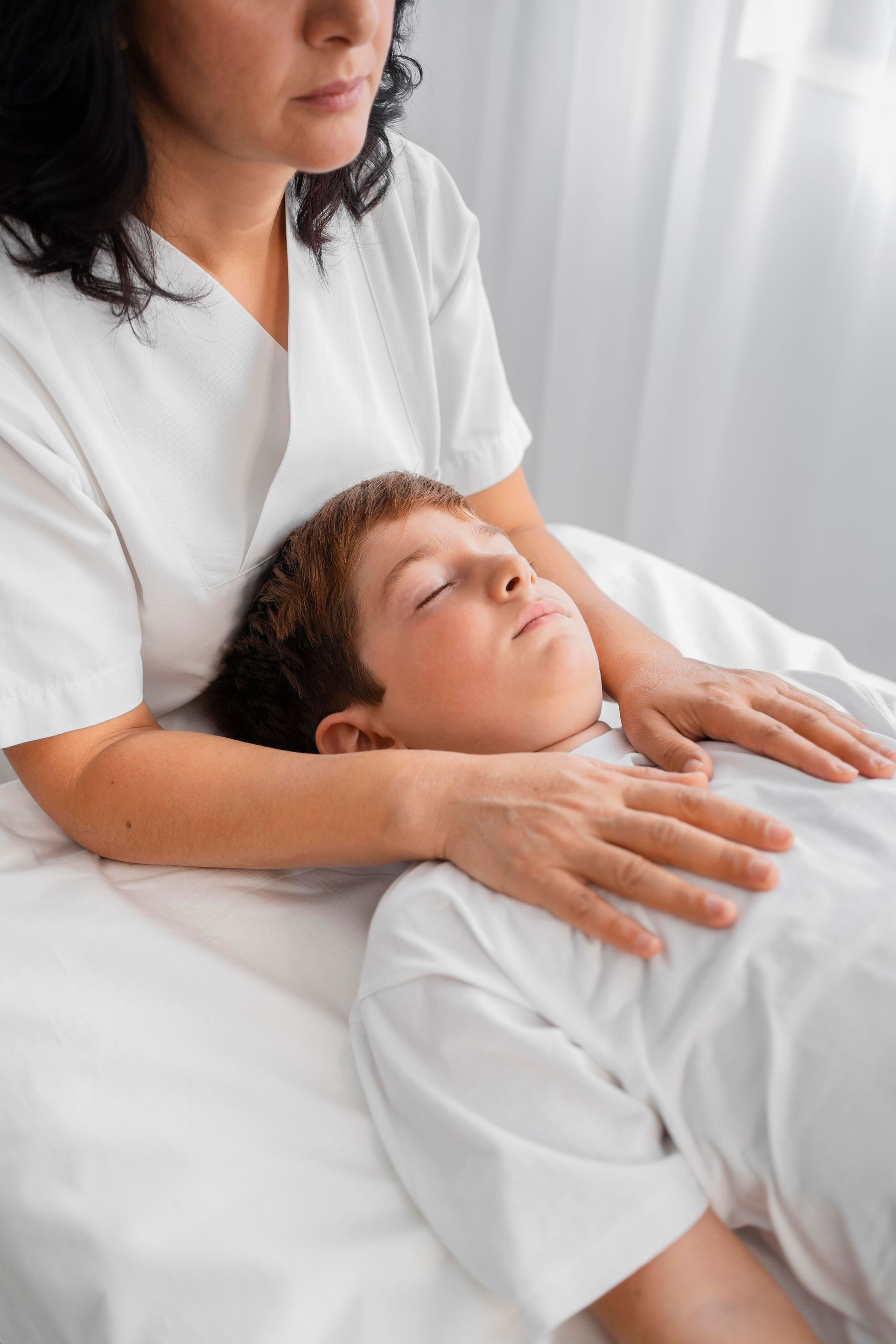 Young boy getting a massage from a masseuse