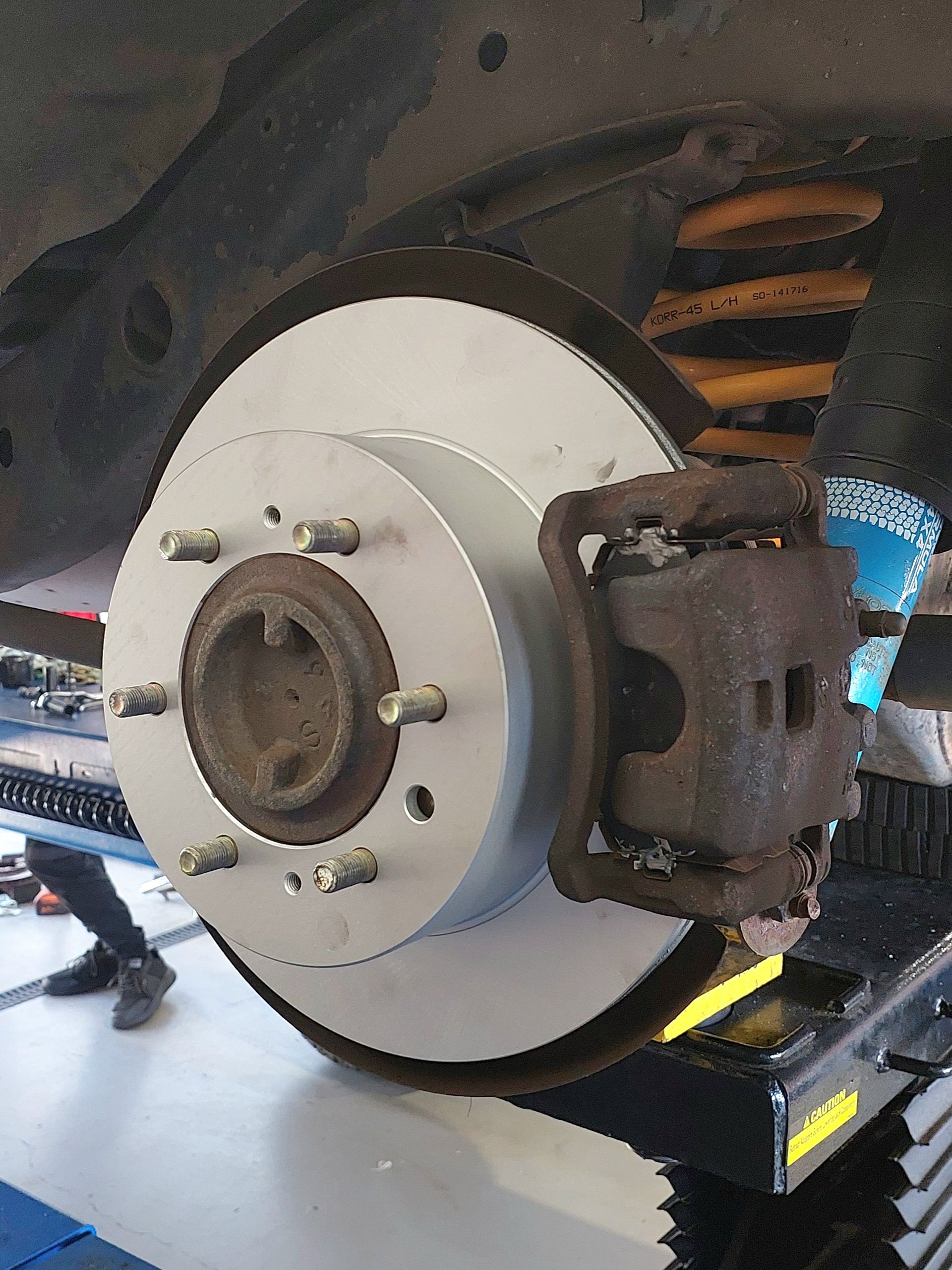 A Wheel Hub And Brake Is Being Checked — Marcoola Tyre & Mechanical In Marcoola, QLD
