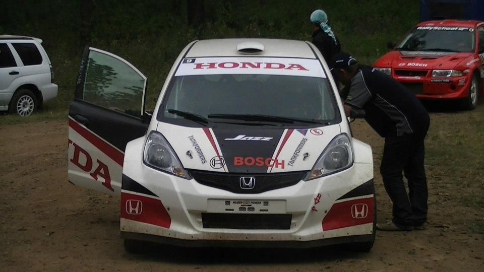 A Honda Car Is Parked In A Dirt Field — Marcoola Tyre & Mechanical In Marcoola, QLD