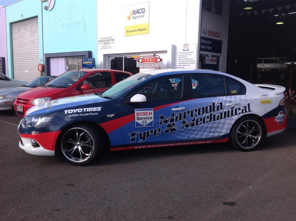 A Car With A Bosch Logo On The Side Is Parked In Front Of A Building — Marcoola Tyre & Mechanical In Marcoola, QLD