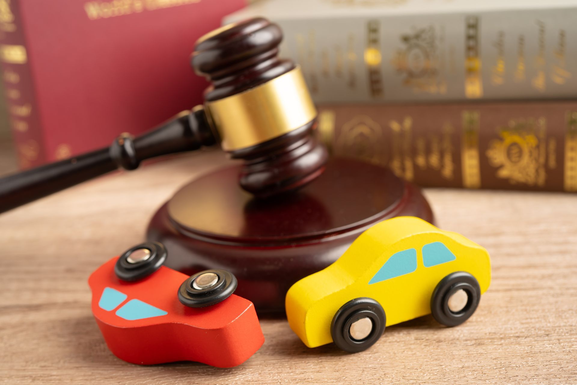 Car injury lawyer reviewing a car accident claim file with an injured client.