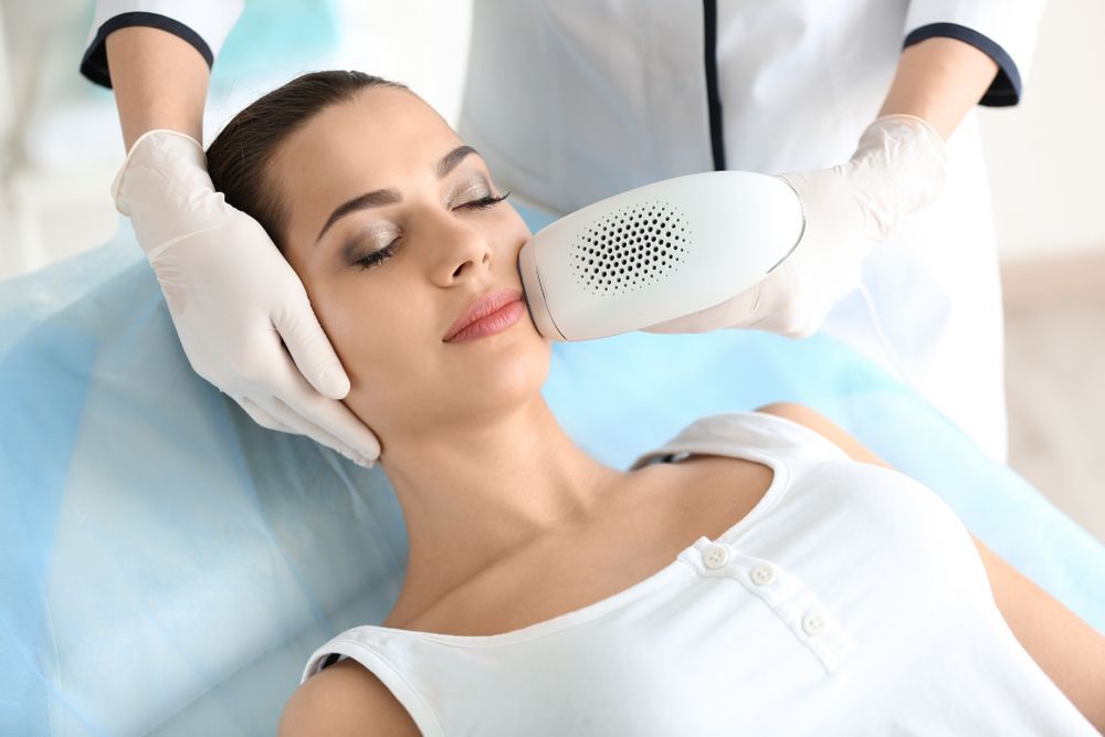 Woman Receiving Facial Treatment — Hope Laser and Beauty Clinic In Forster, NSW