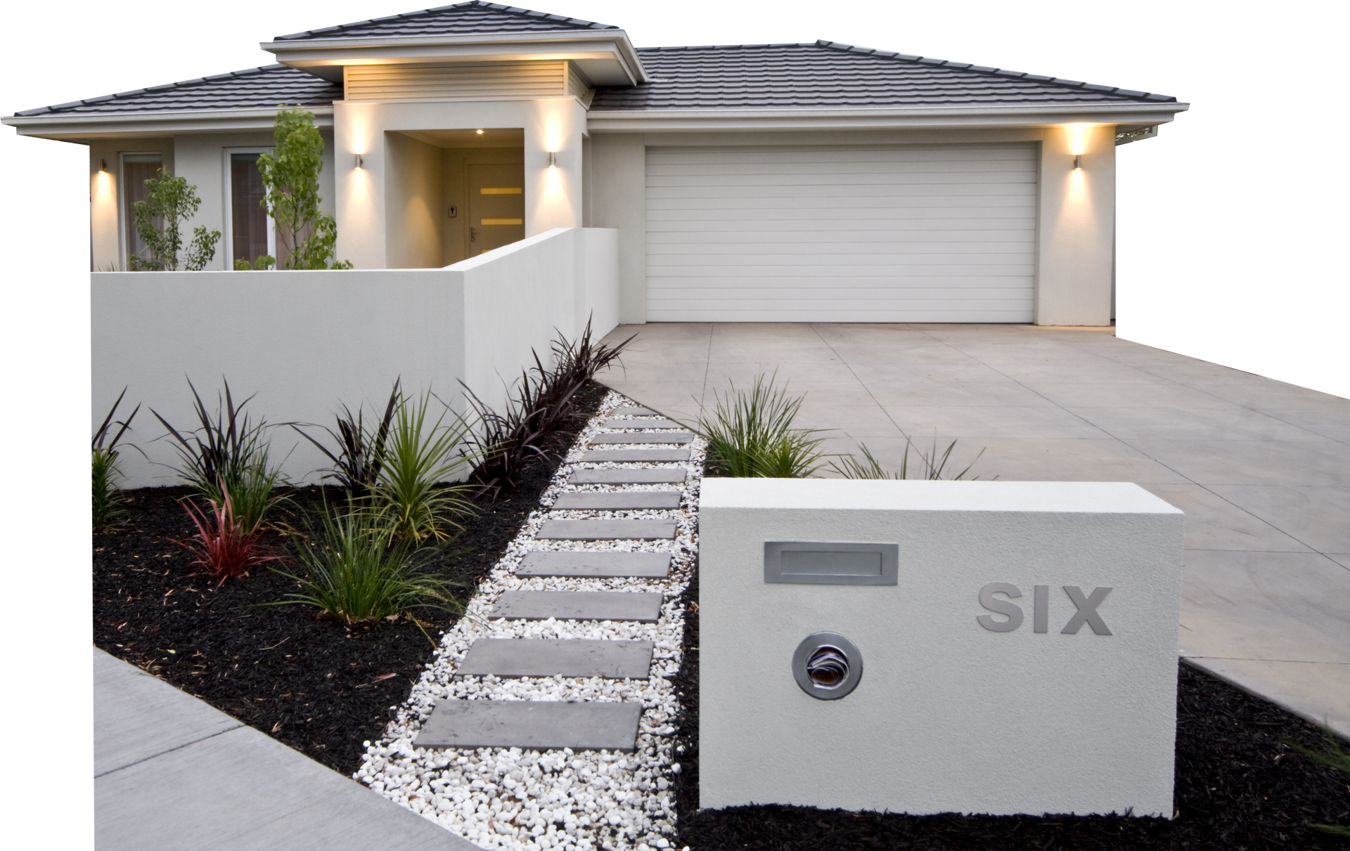 Modern brick house with a driveway, front garden, and mailbox labeled “SIX”